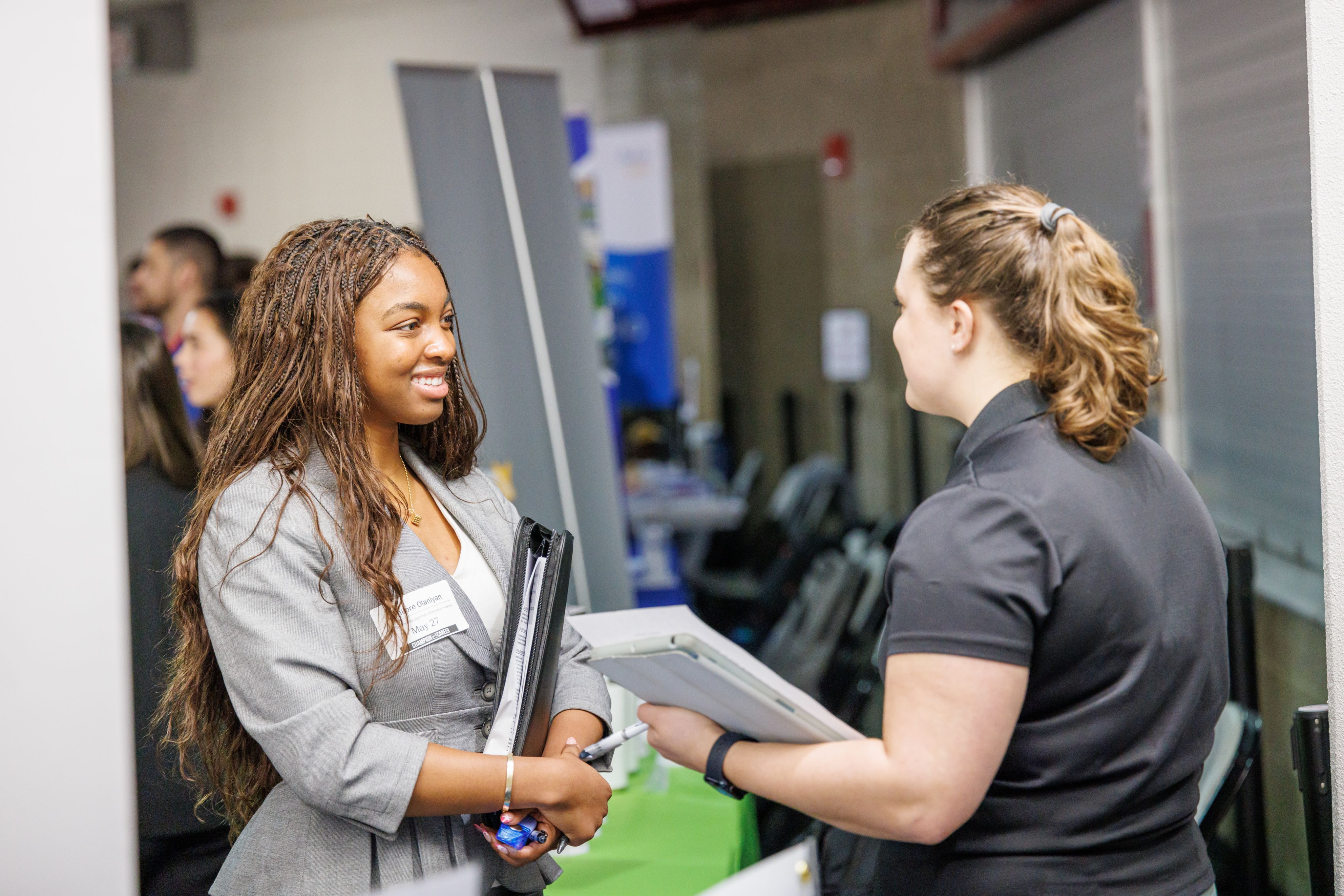 student and employer talk at career fair