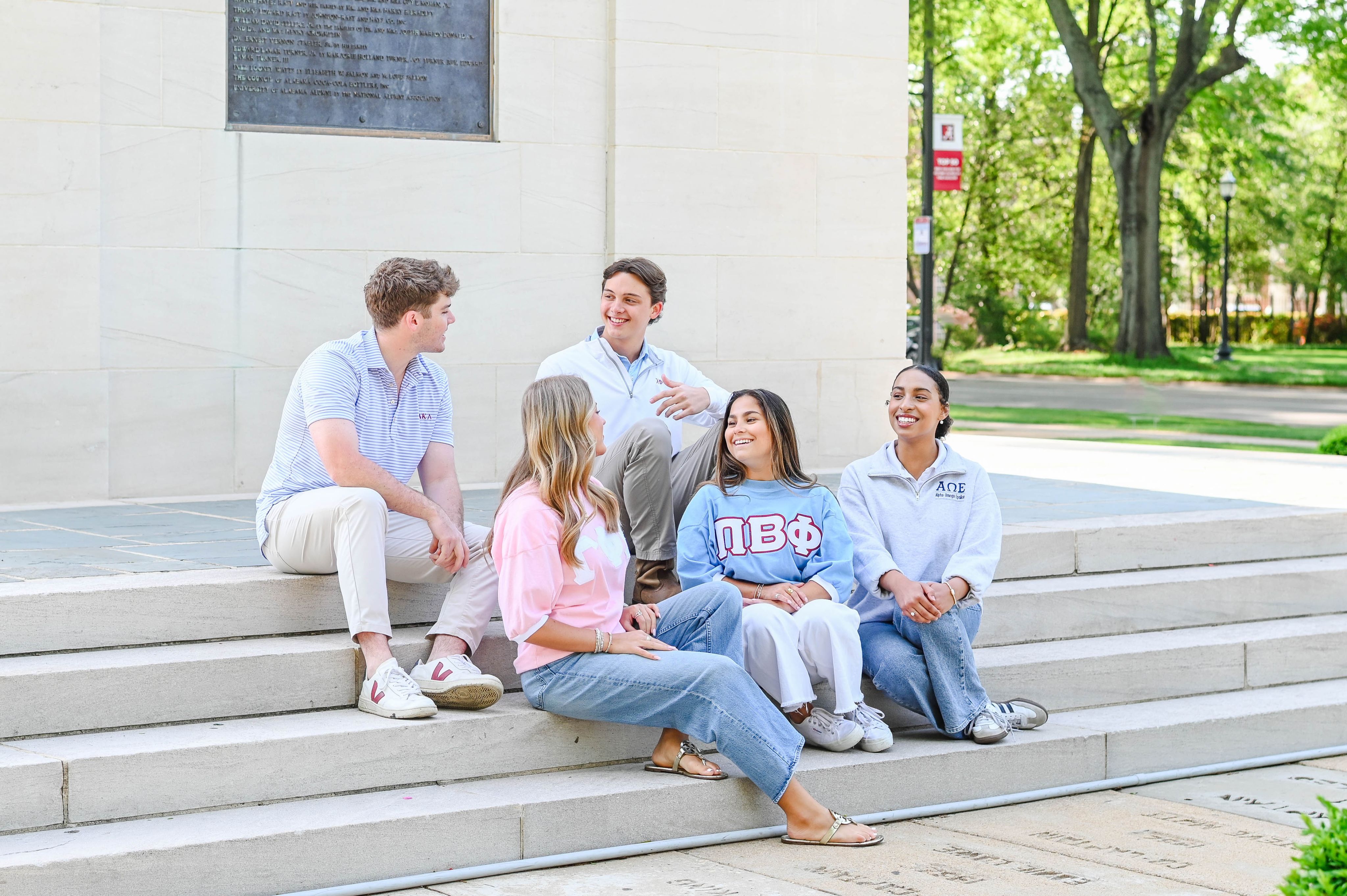greek students talking amongst each other in a group