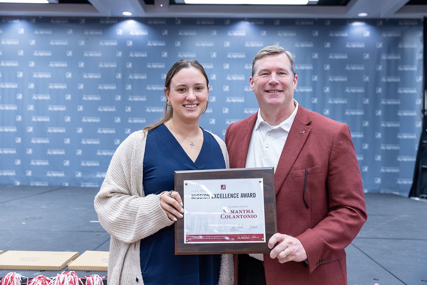 Samantha accepting the award from Dr. Hood