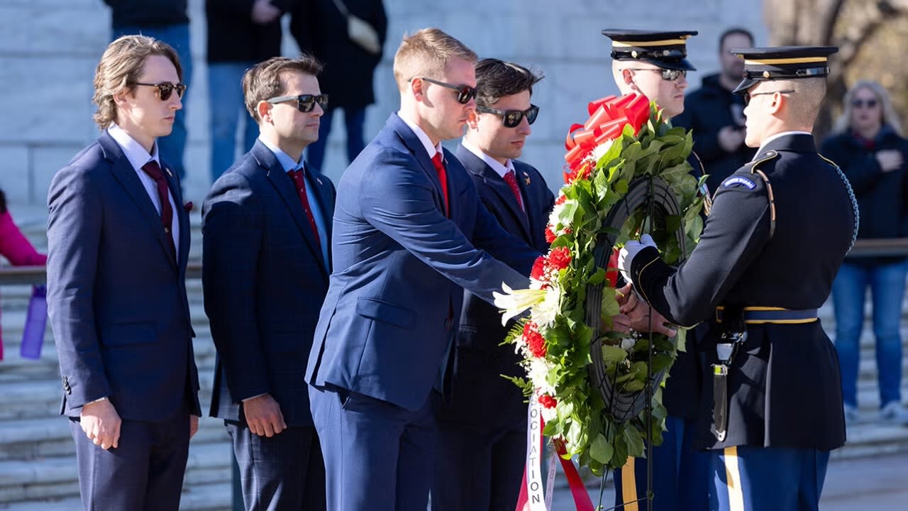 students place wreath