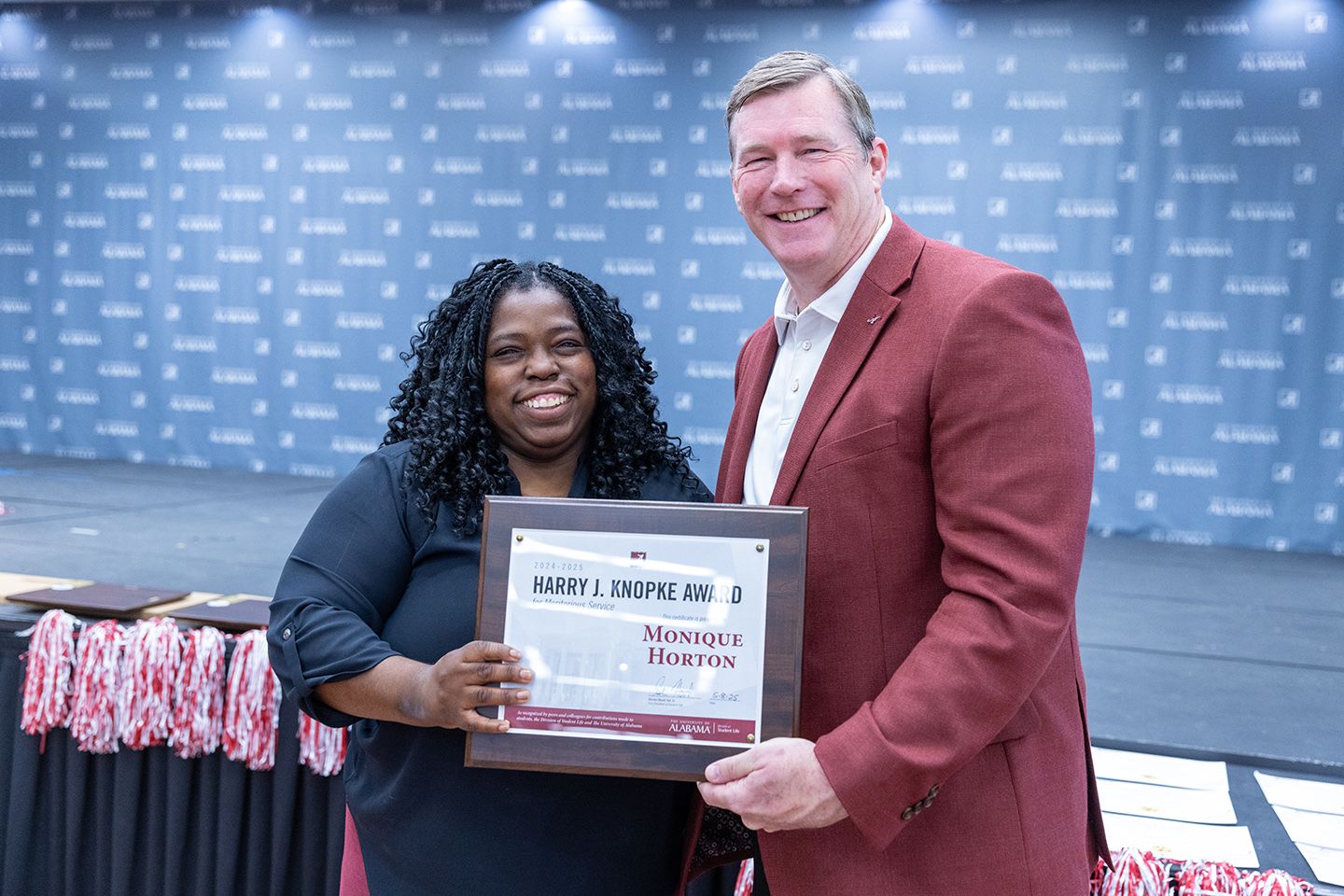 Monique accepting award from Dr. Hood