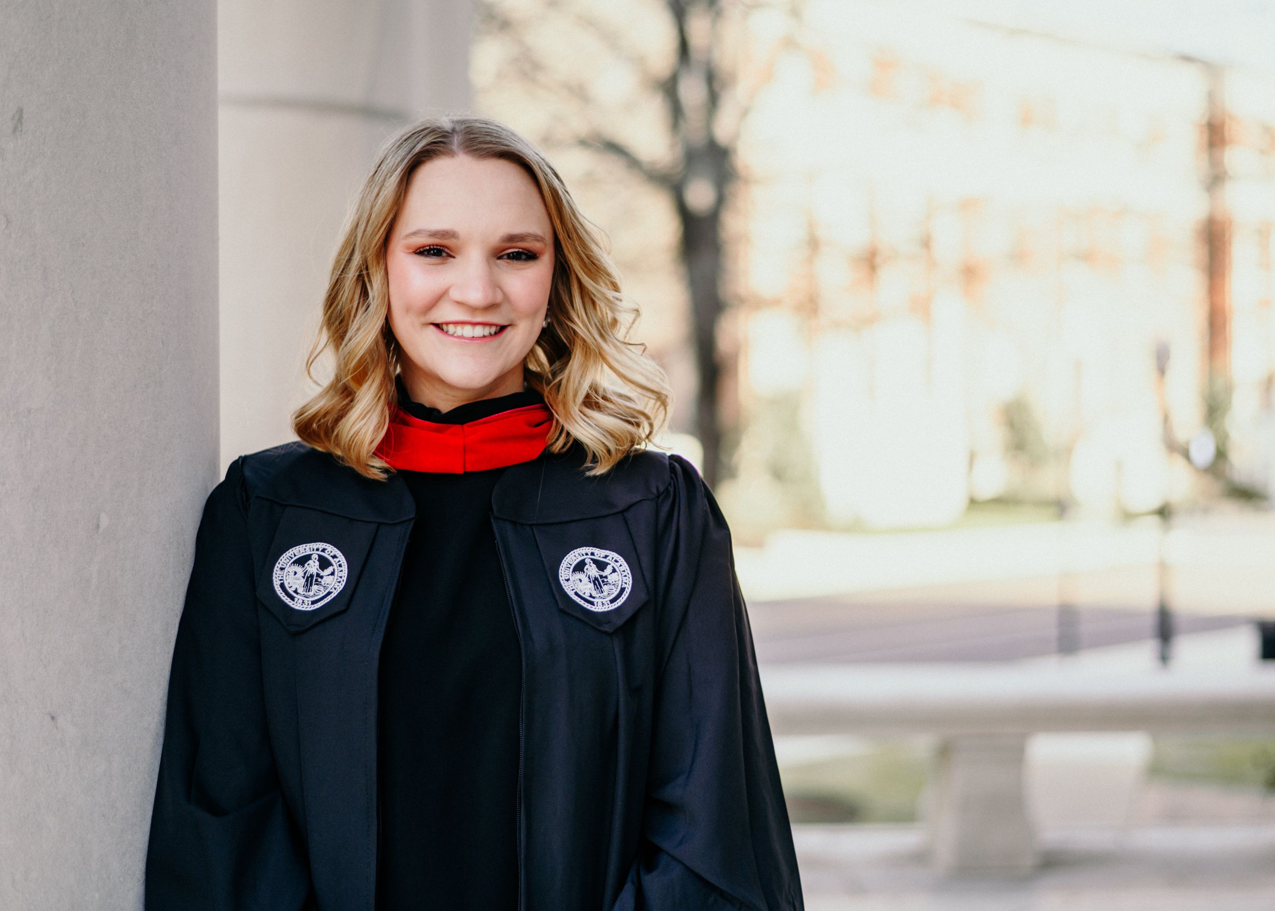 Mishay poses in graduation gown