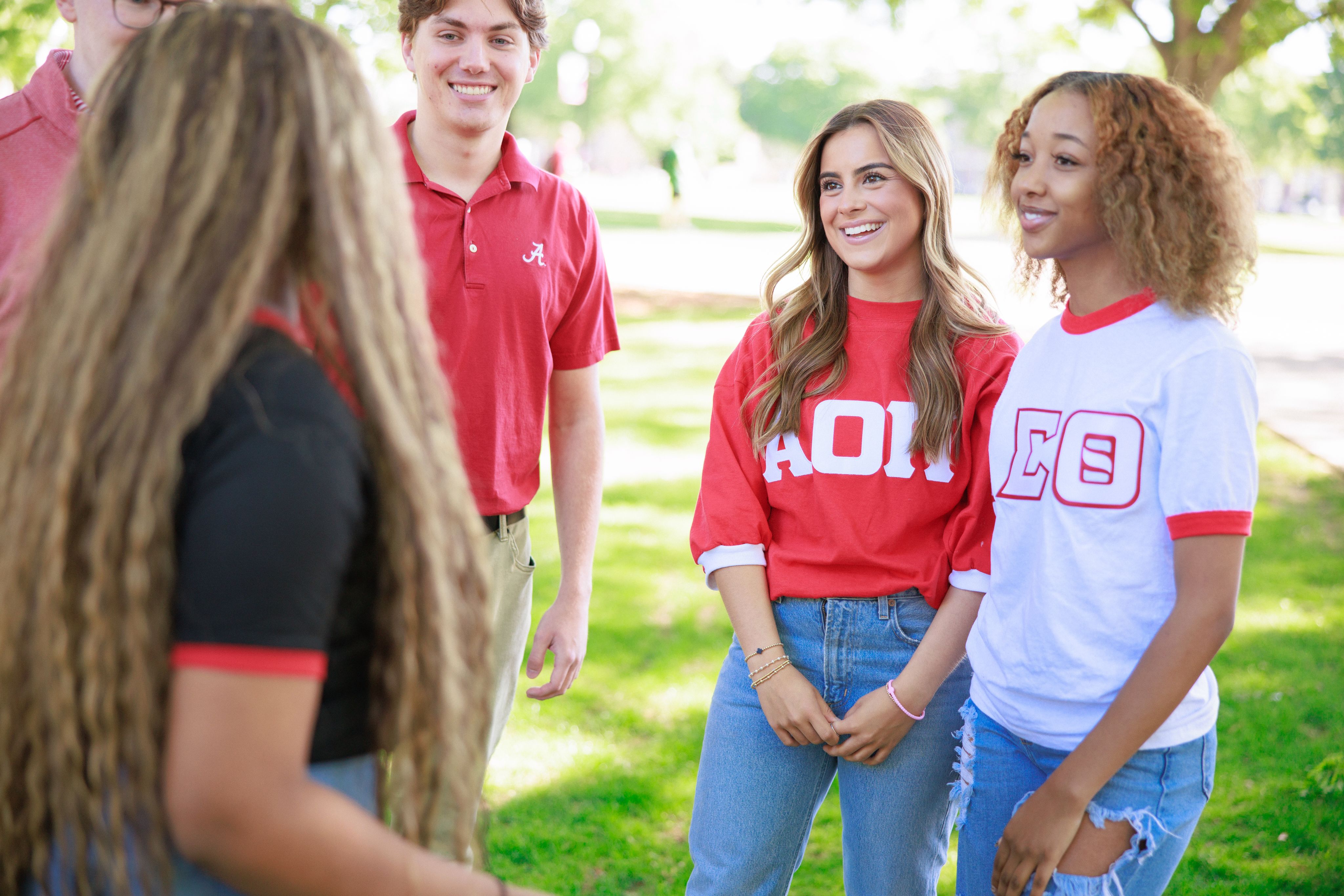 greek students talking amongst each other in a group