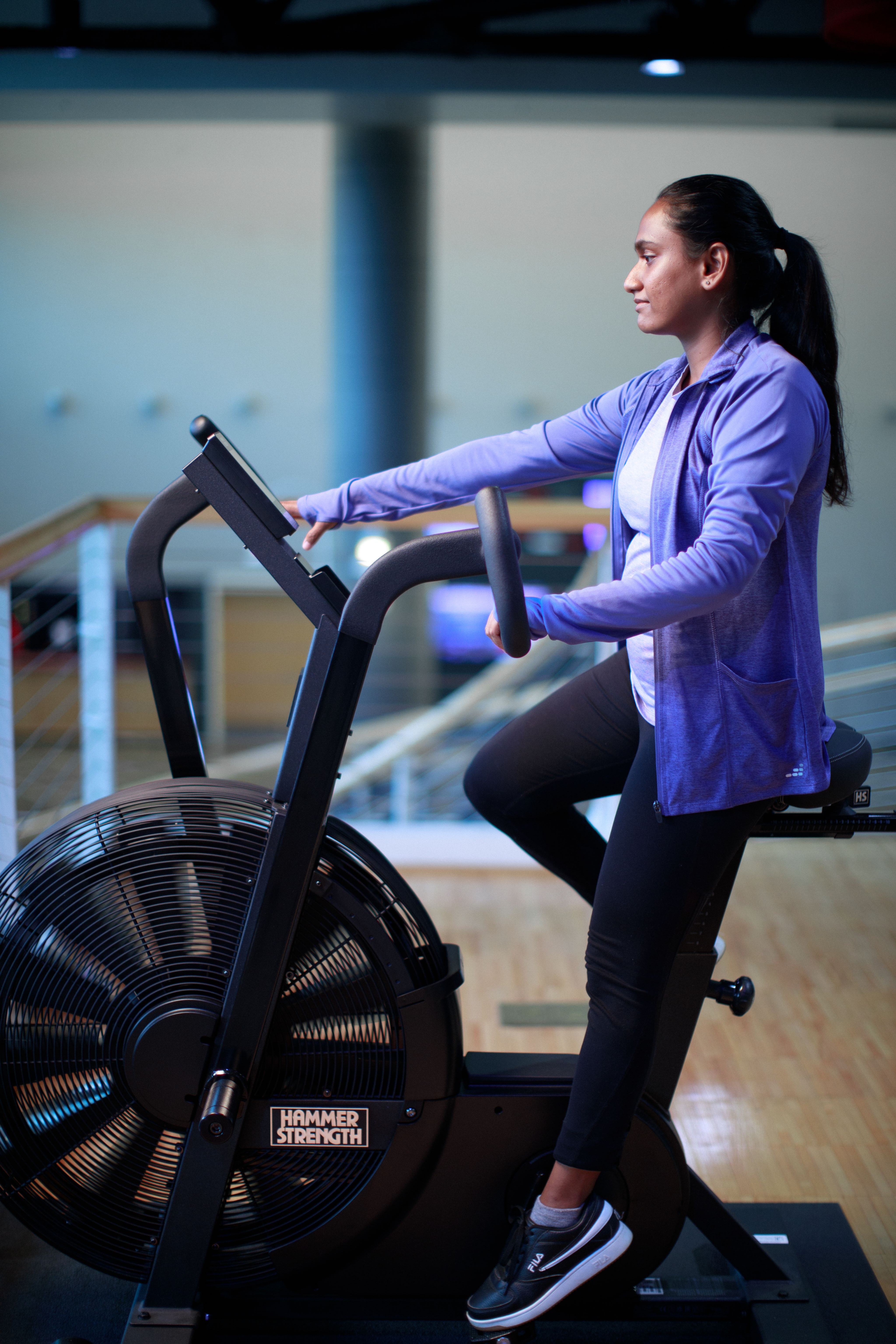 a student uses an electric workout bicycle