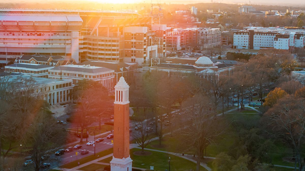 an aerial shot of denny chimes and bryant-denny stadium
