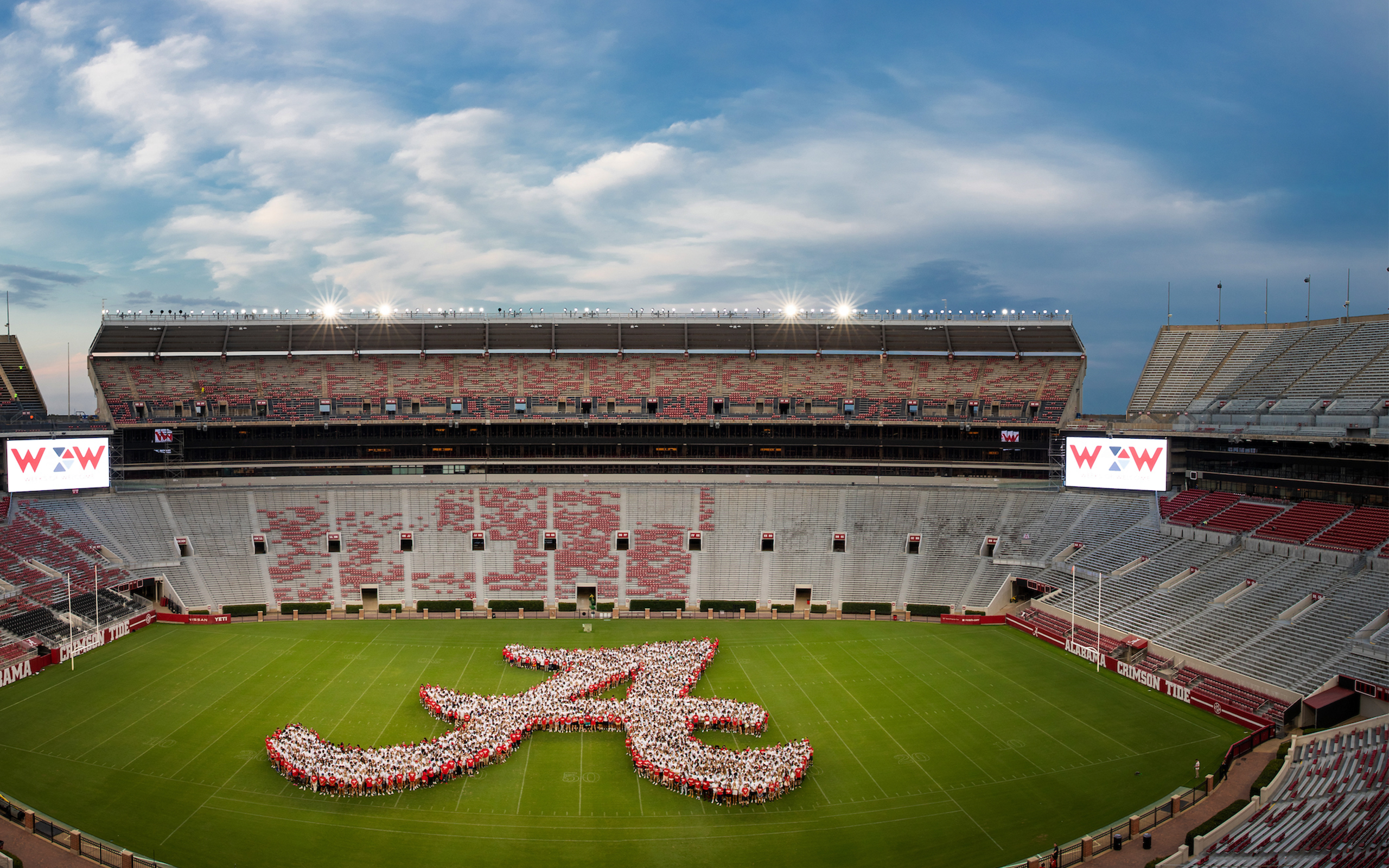 UA students forming a script A in the middle of Bryant Denny Stadium