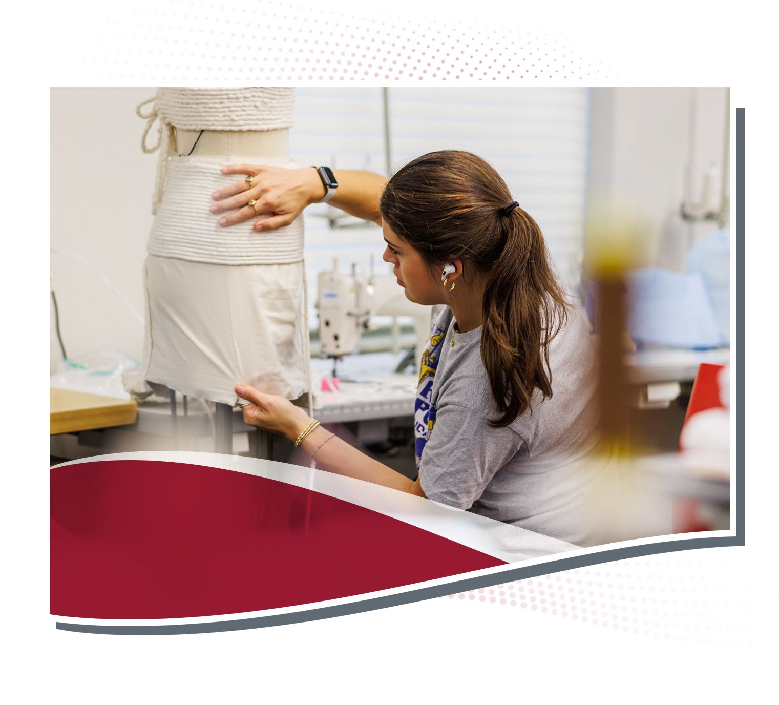 Laken Thompson fitting clothes to a mannequin.