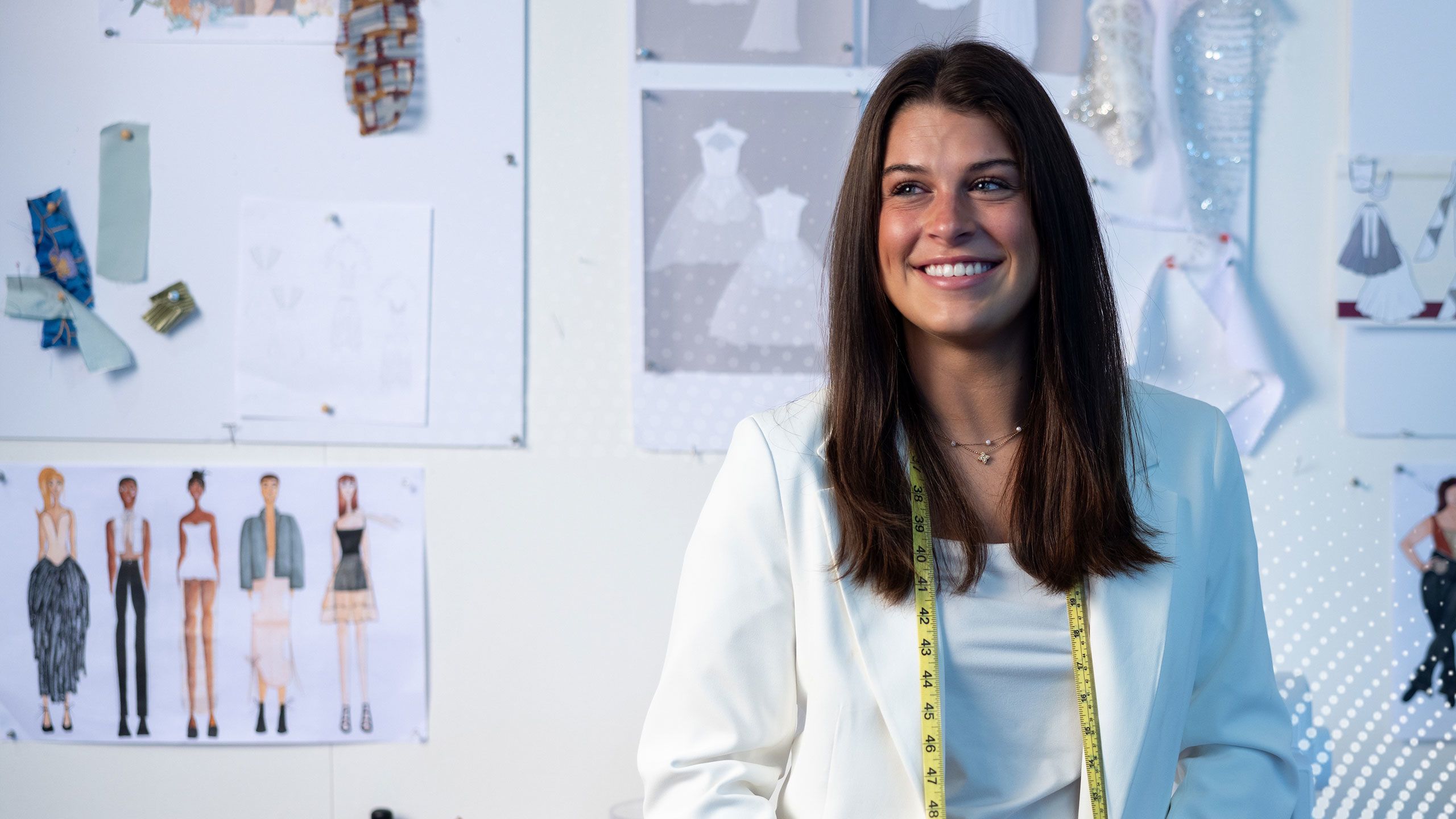 Laken Thompson poses with some of her fashion designs.