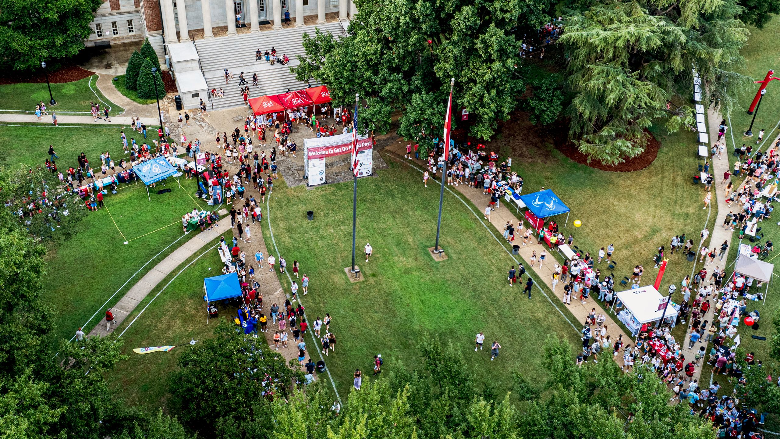 Aerial drone shot of a large group gathering.