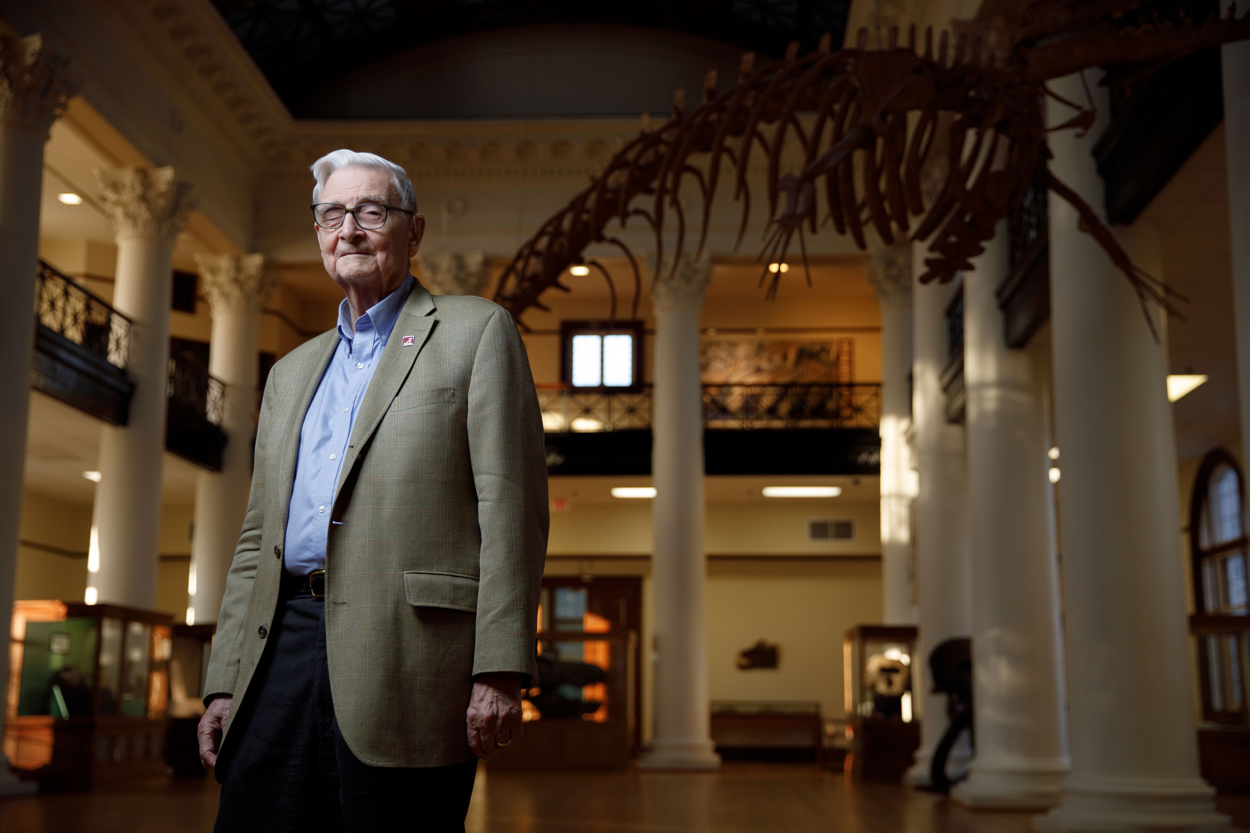 E.O. Wilson stands in the atrium of Smith Hall