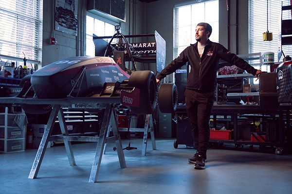 Cole Frederick with the UA Racing team car