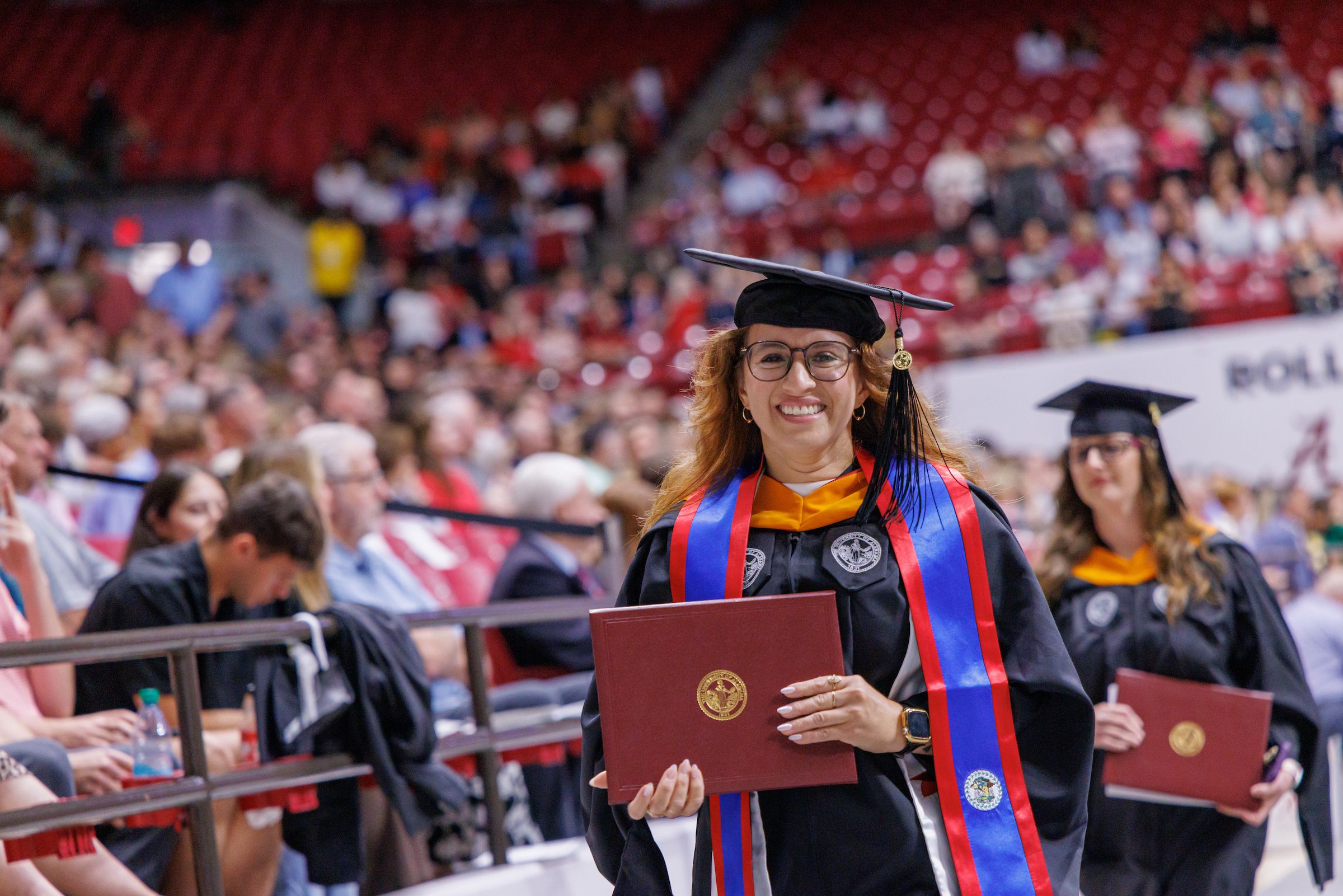 university of alabama student receiving her masters degree