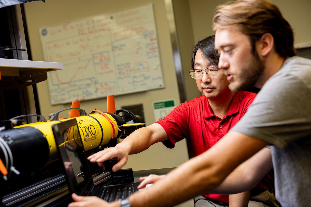 student and professor in research lab 