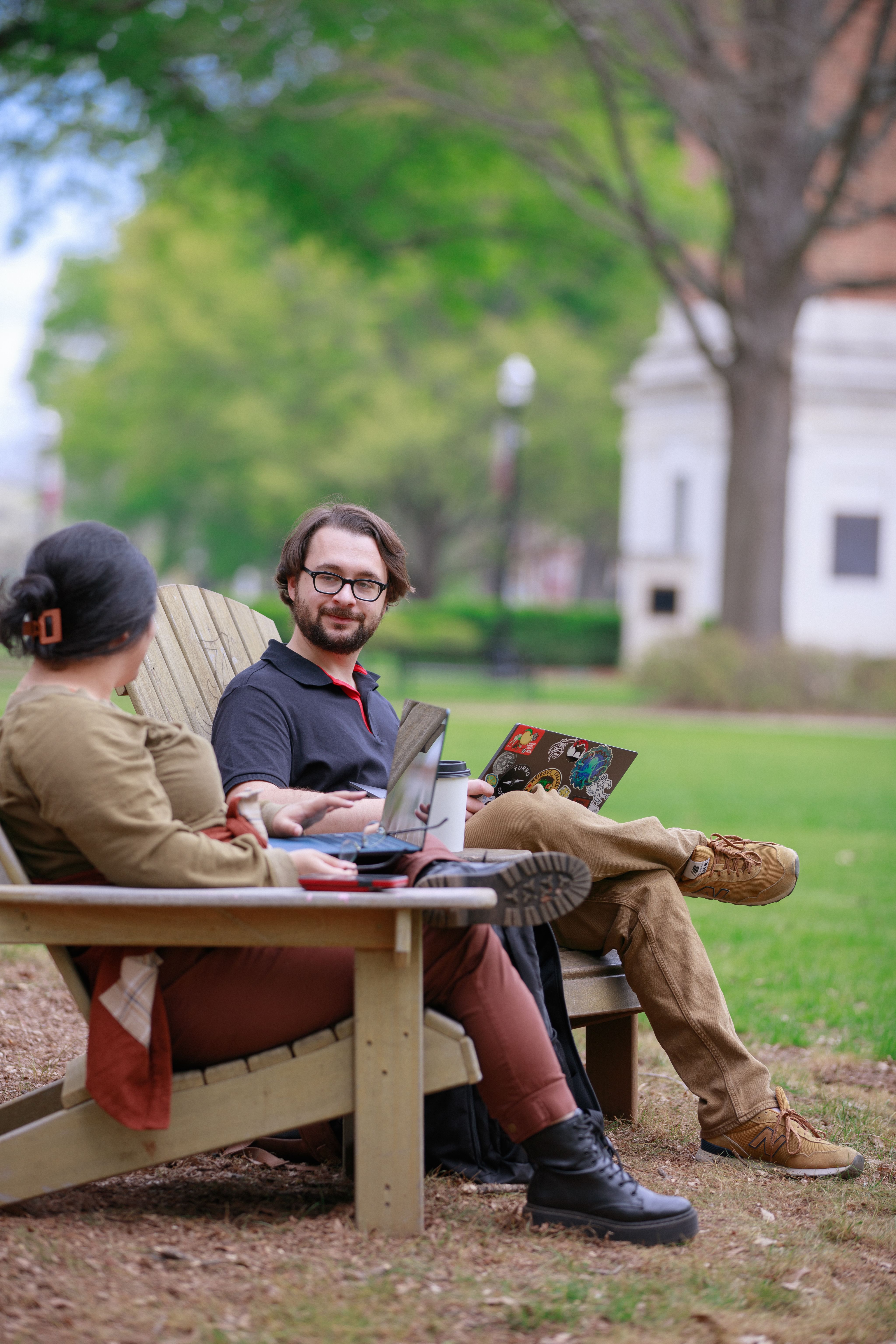Students talking while sitting on the quad