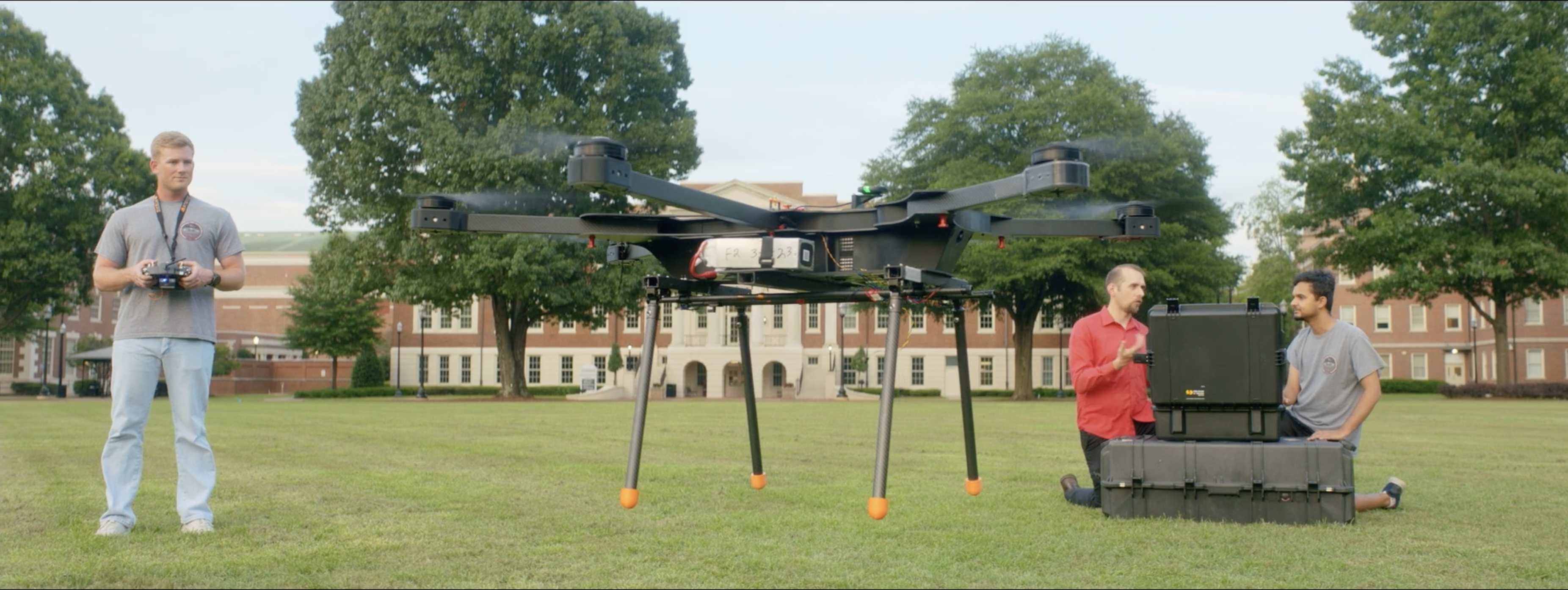 Zac flies a drone on the UA quad.
