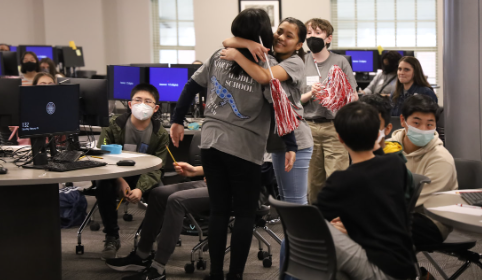 Photo of MATHCOUNTS participants congratulating one another.