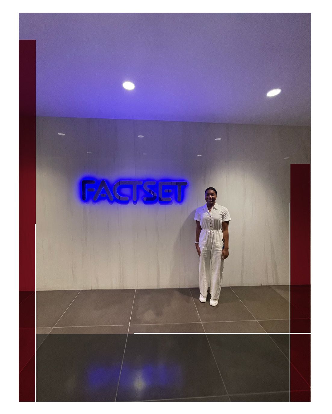 Summer posing in front of a blue neon sign reading FACTSET.