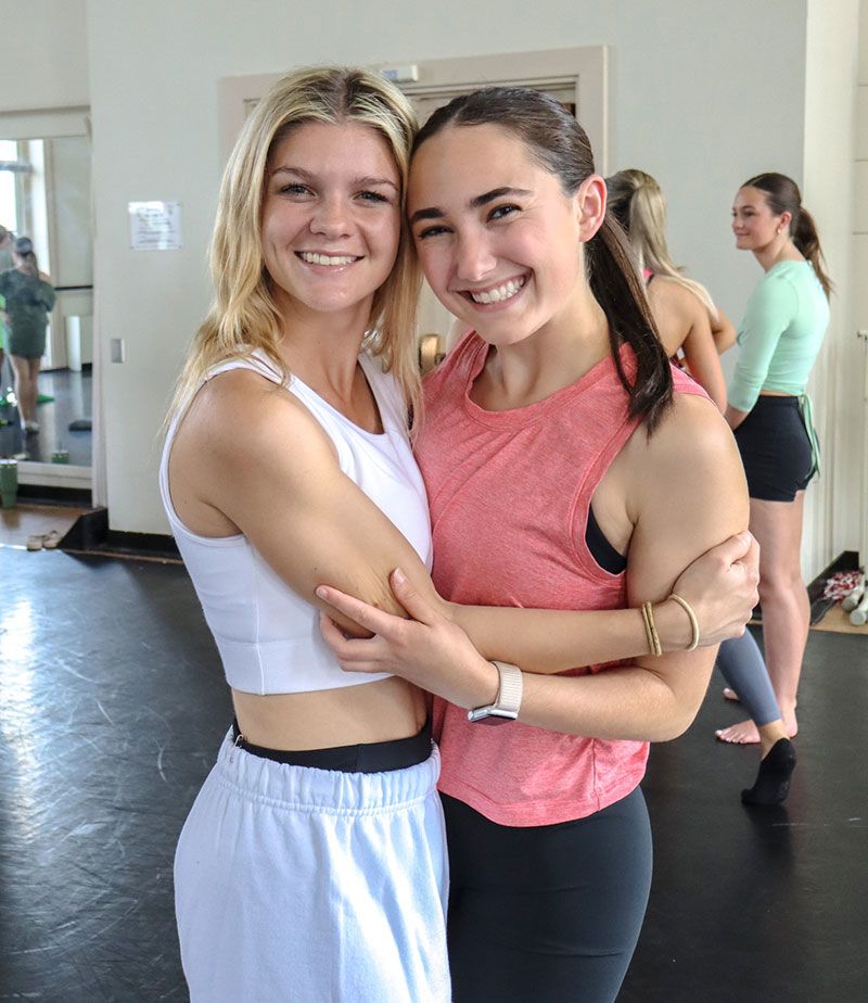 Brittany Grigorian poses with her friend from a dance performance.