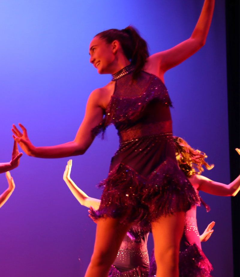 Brittany Grigorian dancing on stage during a performance.