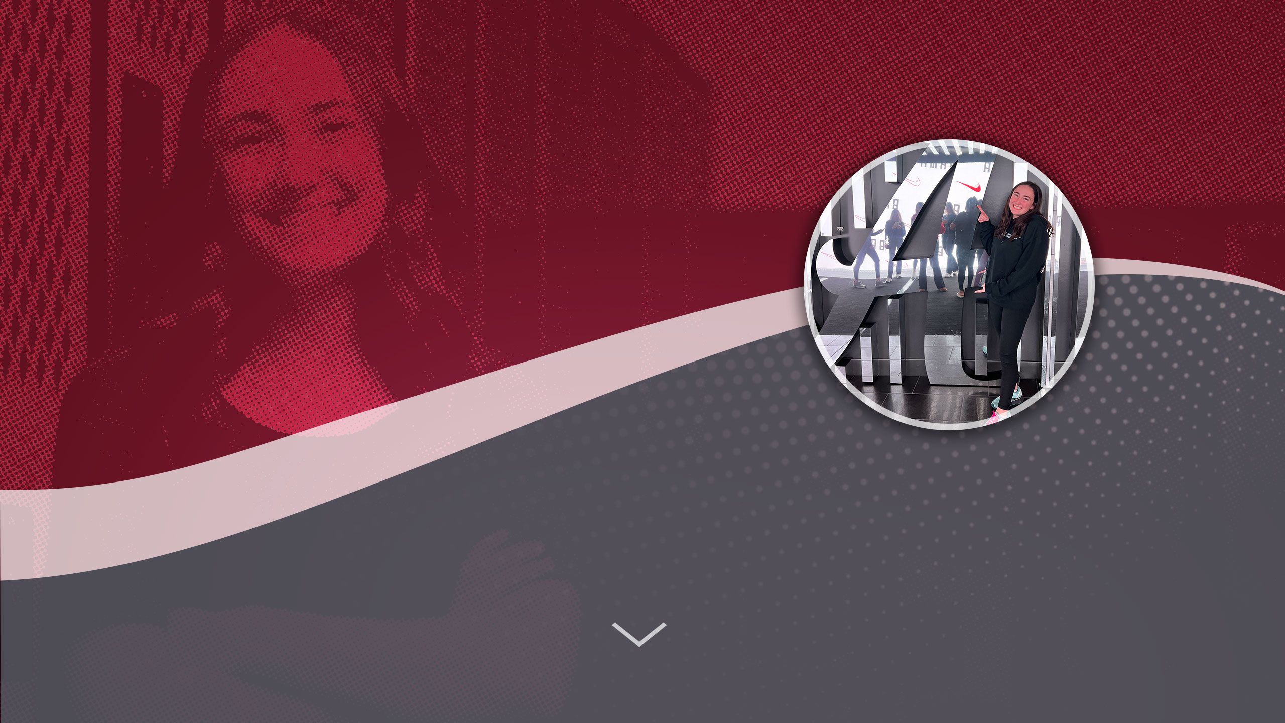 Brittany Grigorian poses in front of a large UA logo.