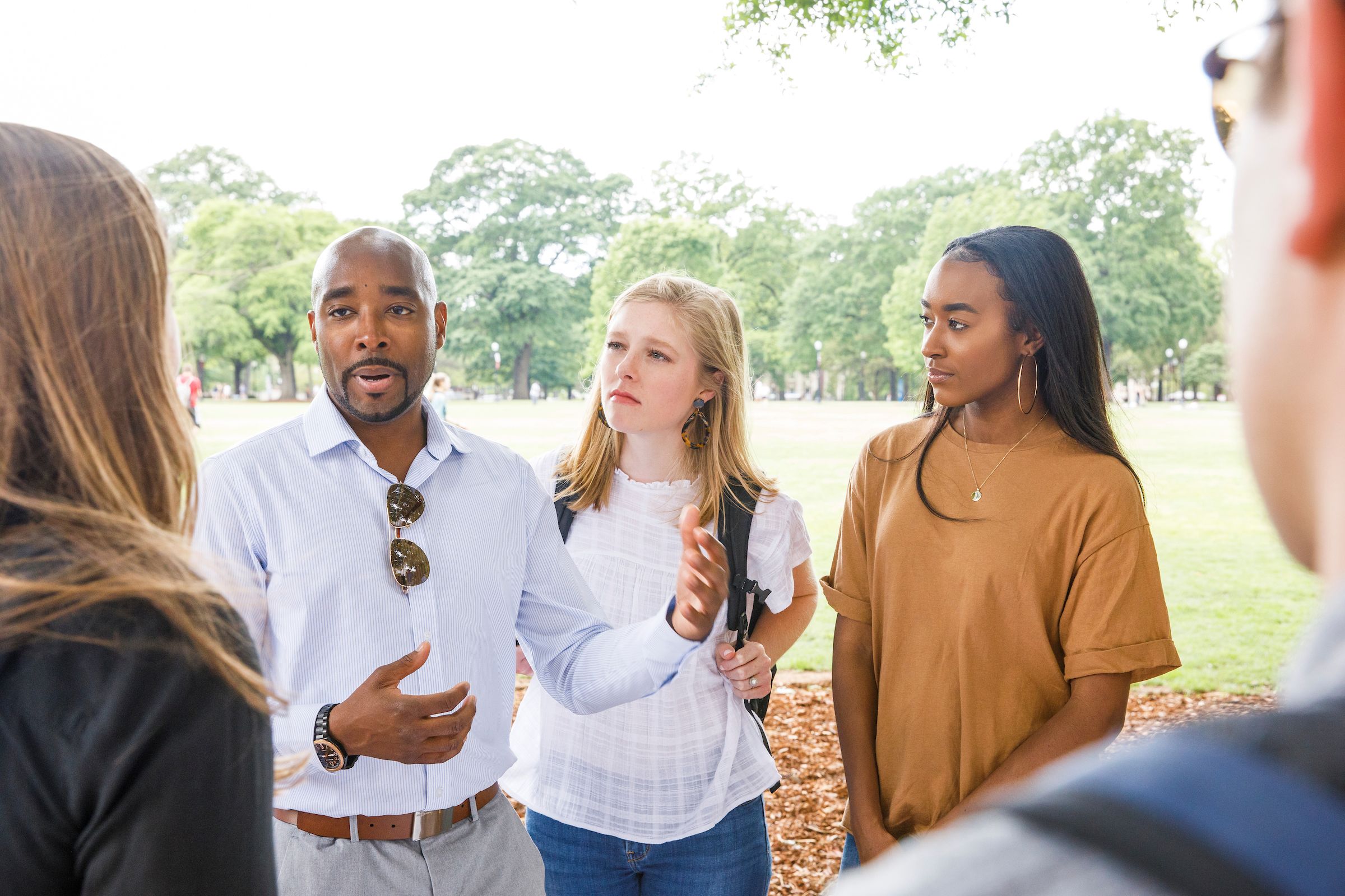 UA students listening intently to another student presenting