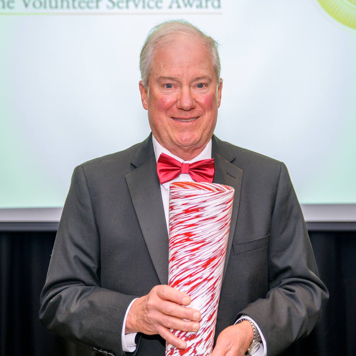 A photo of Dr. Allen Yeilding holding his award.