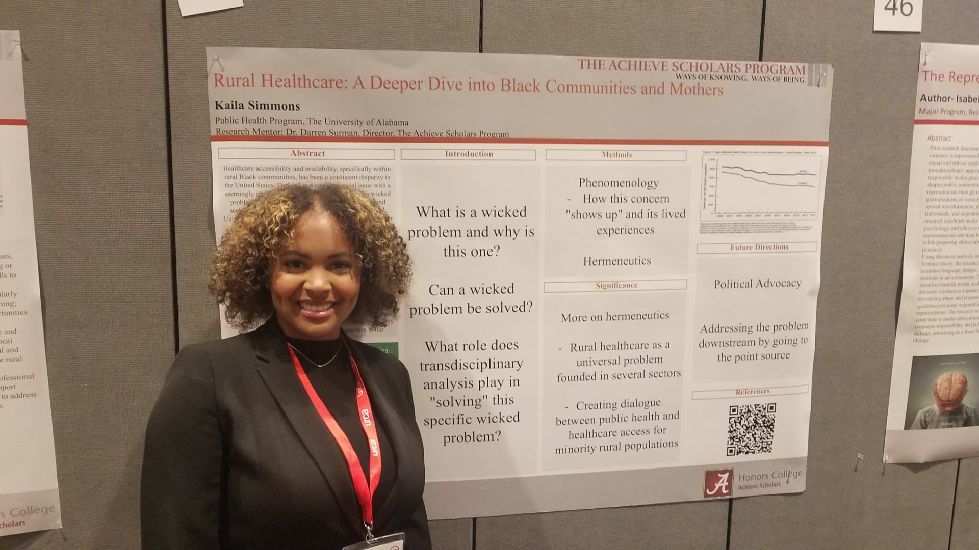 Achieve Scholar Kaila Simmons smiles in front of her research poster.