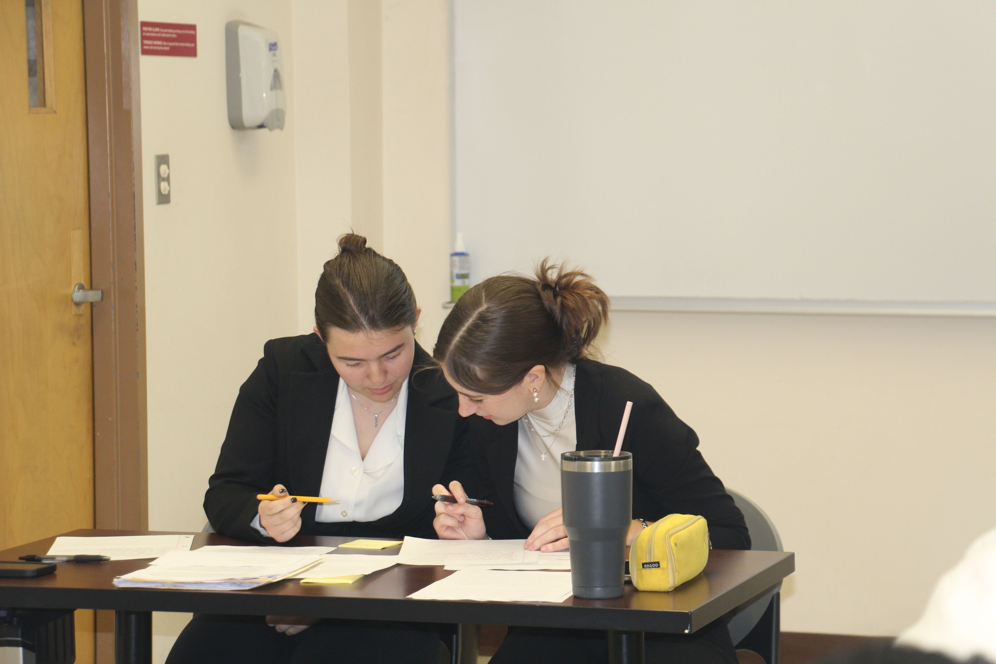 Honors students in Moral Forum prepare their arguments.