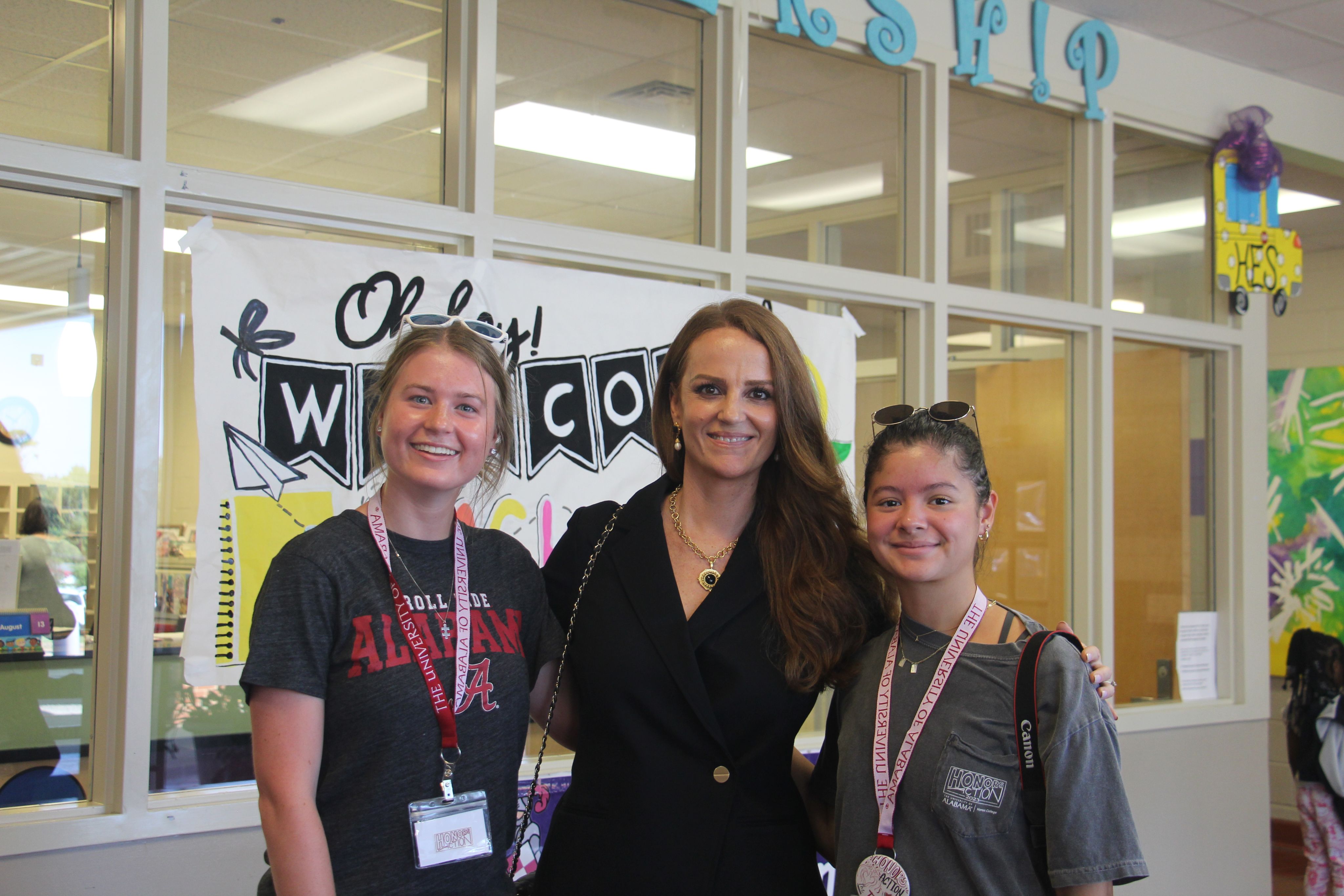 Dean Tiffany Sippial smiles with two Honors Action student leaders.