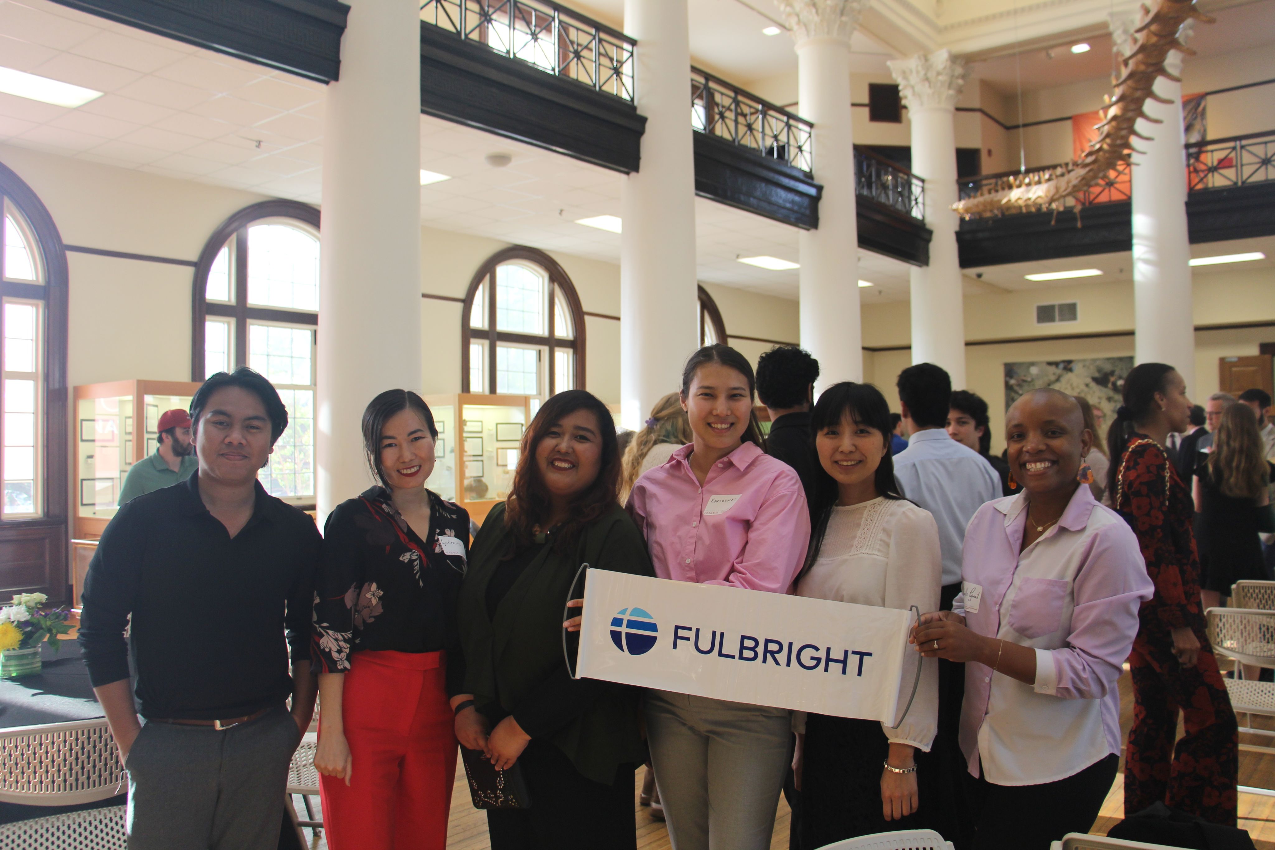 A photo of students holding a Fulbright sign.