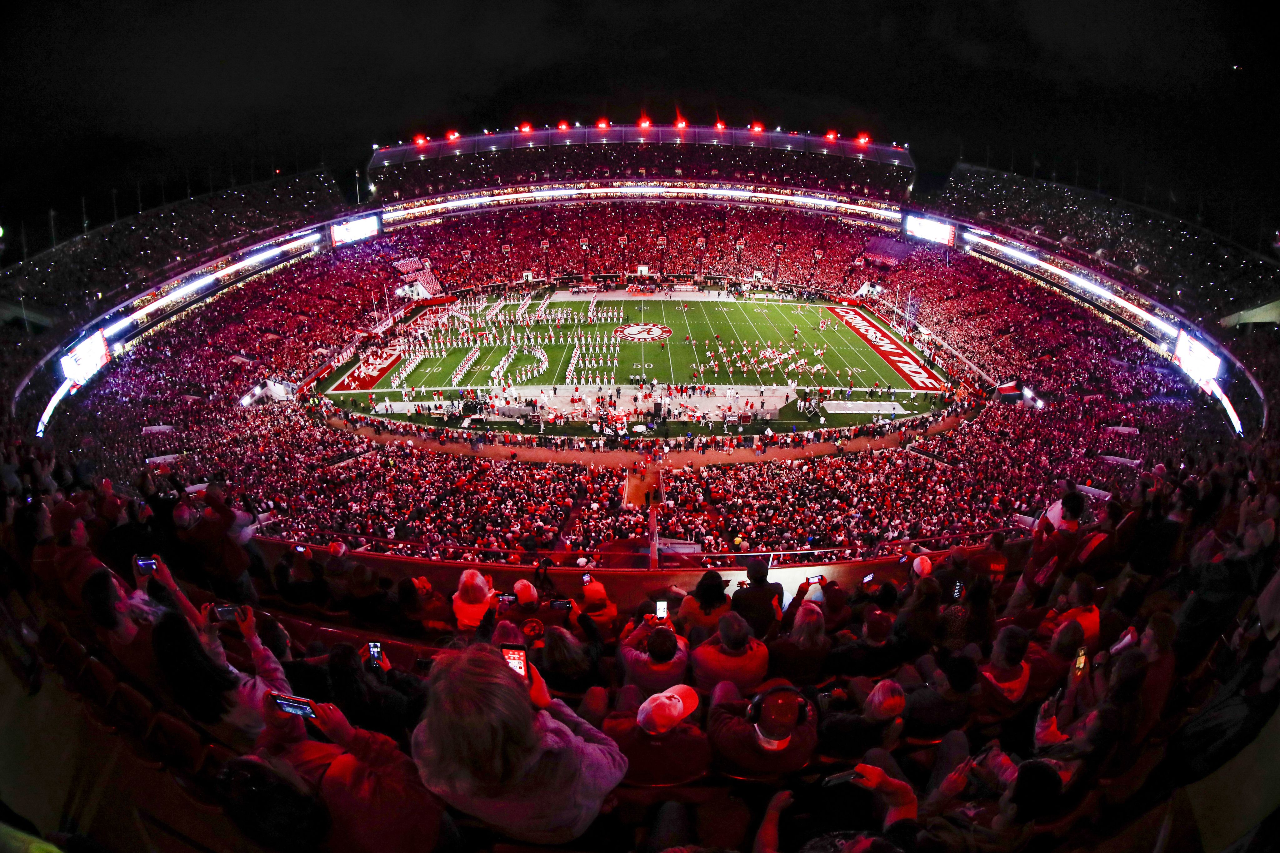 Aerial view of Bryant-Denny stadium at night.