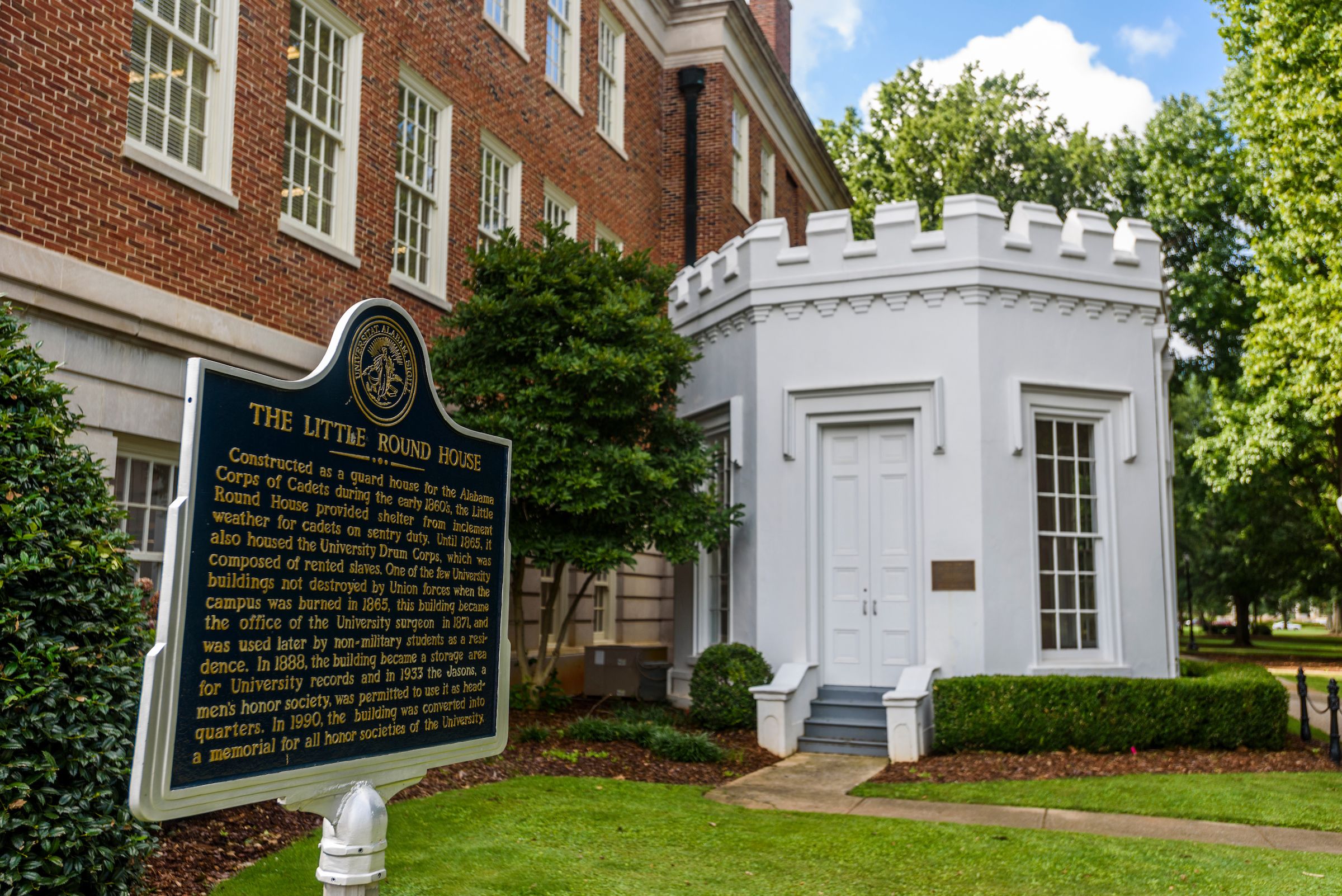 Exterior view of the Round House with the historical marker to the left of the house.